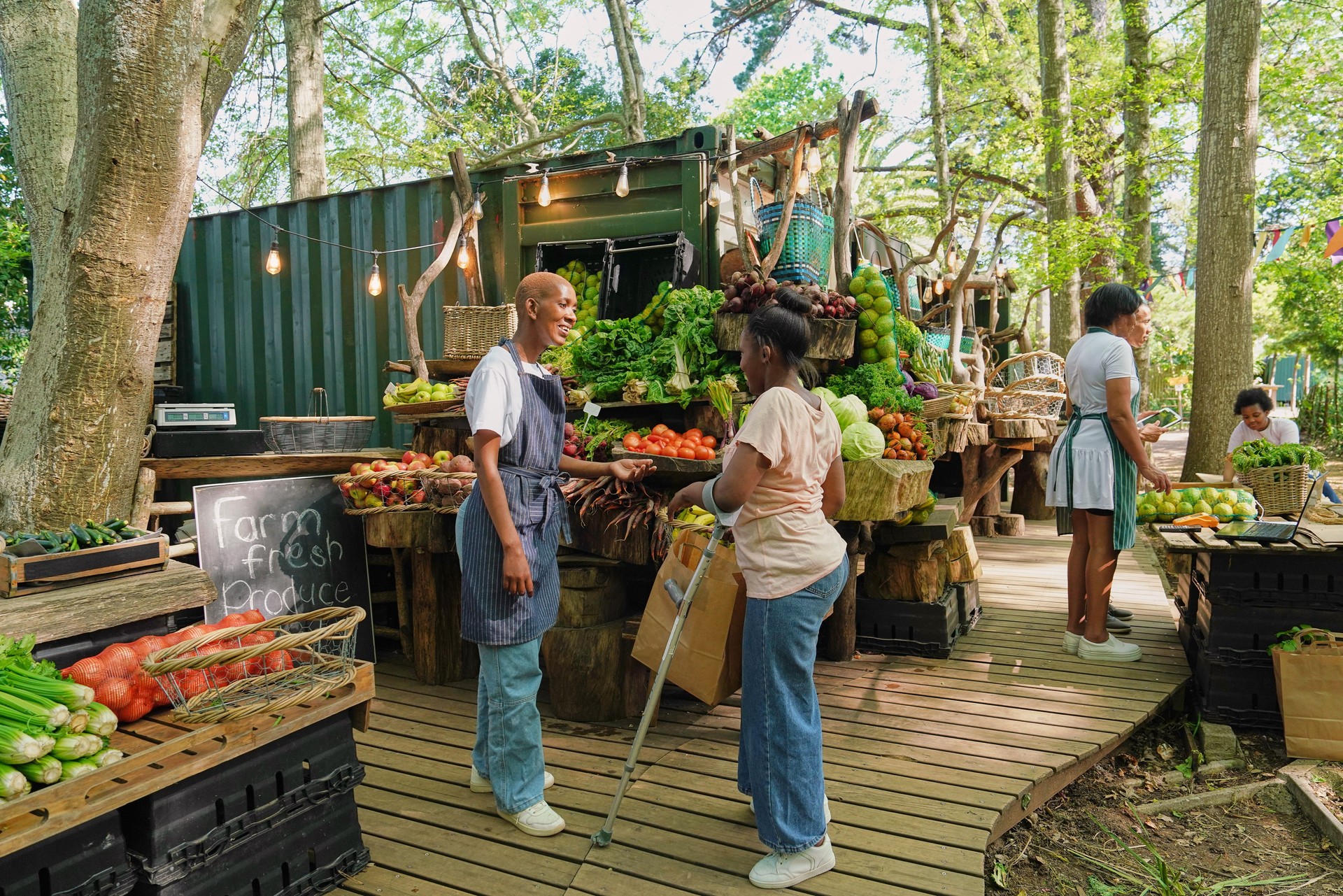 Disabled people working at community farmers market